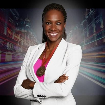 Portrait of Tasha Danvers in a white blazer, wearing her Olympic medal